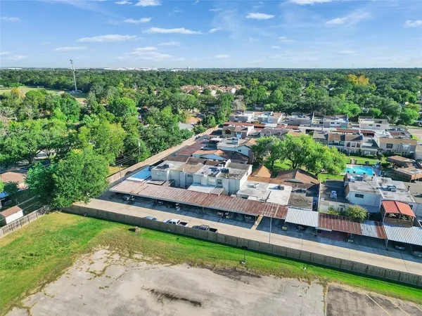 a view of a backyard with sitting area
