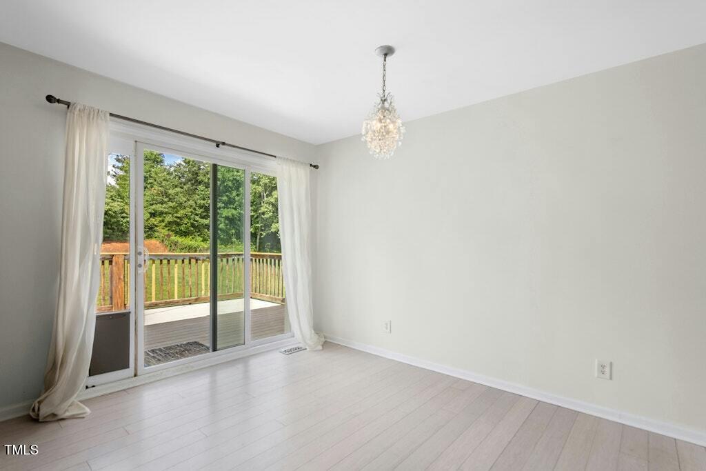 4021 Chaucer Drive Durham, NC 27705 - Photo 10 of 36 a view of an empty room with a balcony