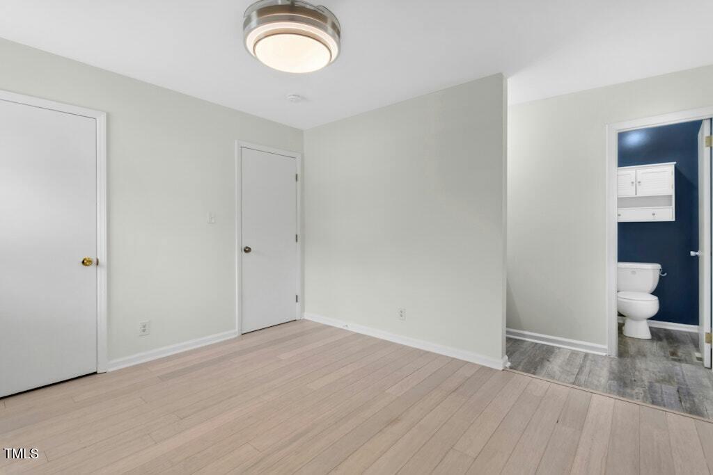 4021 Chaucer Drive Durham, NC 27705 - Photo 19 of 36 a view of a room with wooden floor and a sink