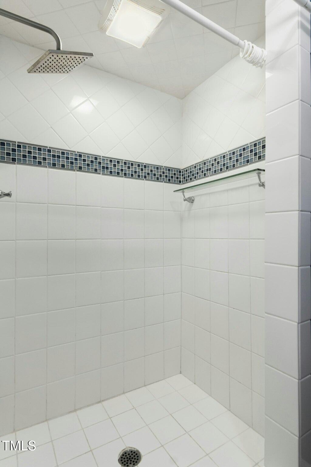 4021 Chaucer Drive Durham, NC 27705 - Photo 21 of 36 a bathroom with a shower