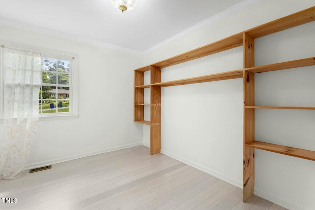 4021 Chaucer Drive Durham, NC 27705 - Photo 26 of 36 an empty room with windows