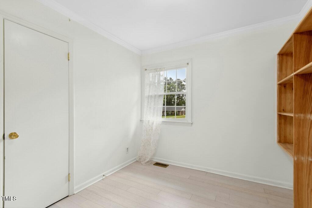4021 Chaucer Drive Durham, NC 27705 - Photo 27 of 36 an empty room with windows