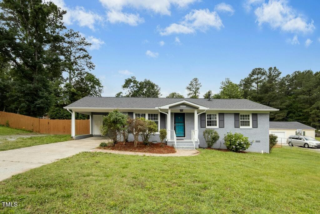 4021 Chaucer Drive Durham, NC 27705 - Photo 2 of 36 a front view of house with yard and green space