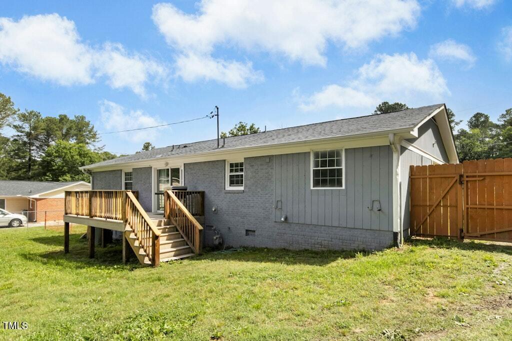 4021 Chaucer Drive Durham, NC 27705 - Photo 30 of 36 a view of a house with yard