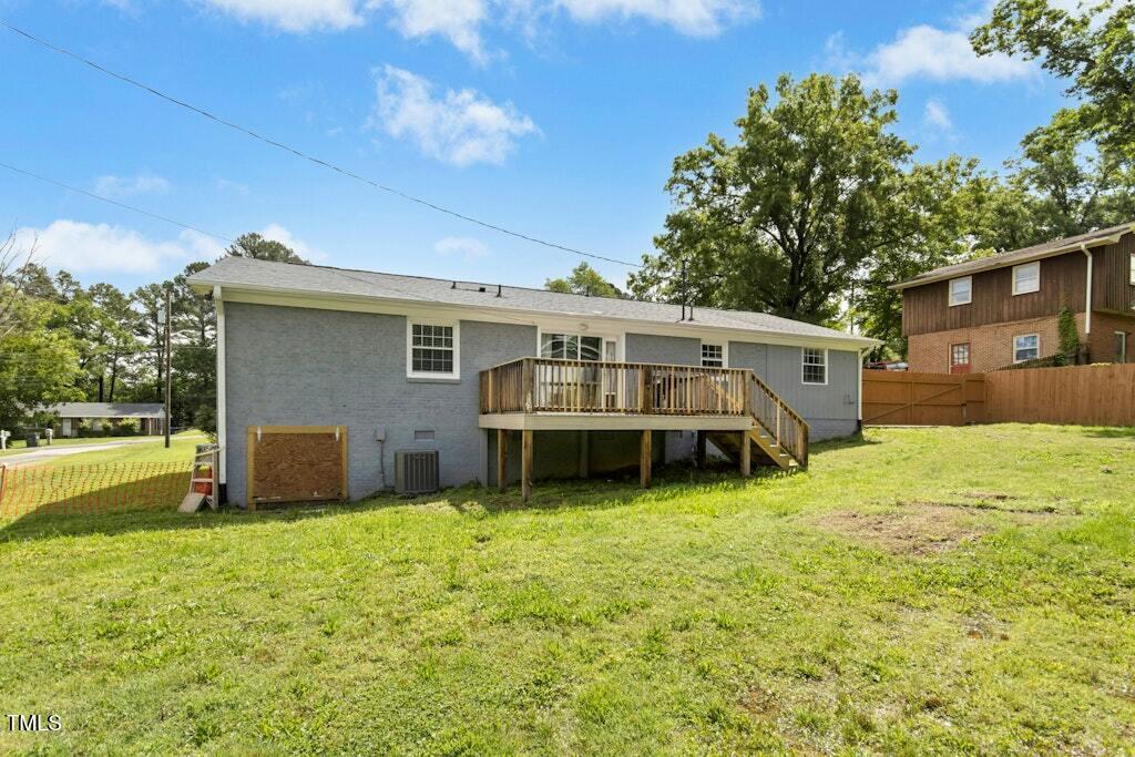 4021 Chaucer Drive Durham, NC 27705 - Photo 33 of 36 a view of a house with a yard