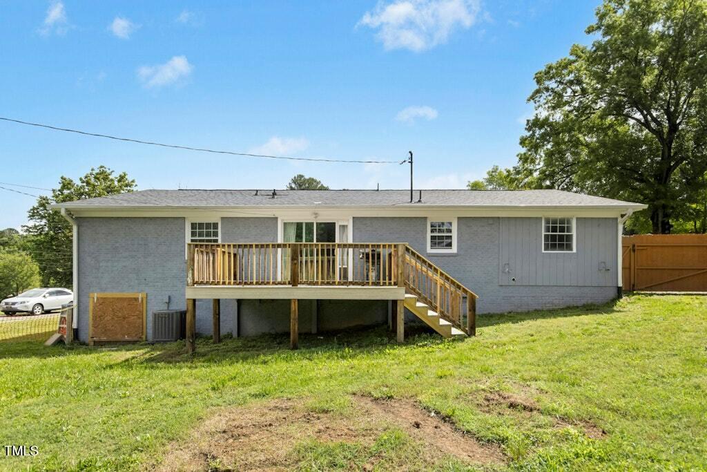 4021 Chaucer Drive Durham, NC 27705 - Photo 34 of 36 a front view of a house with a yard
