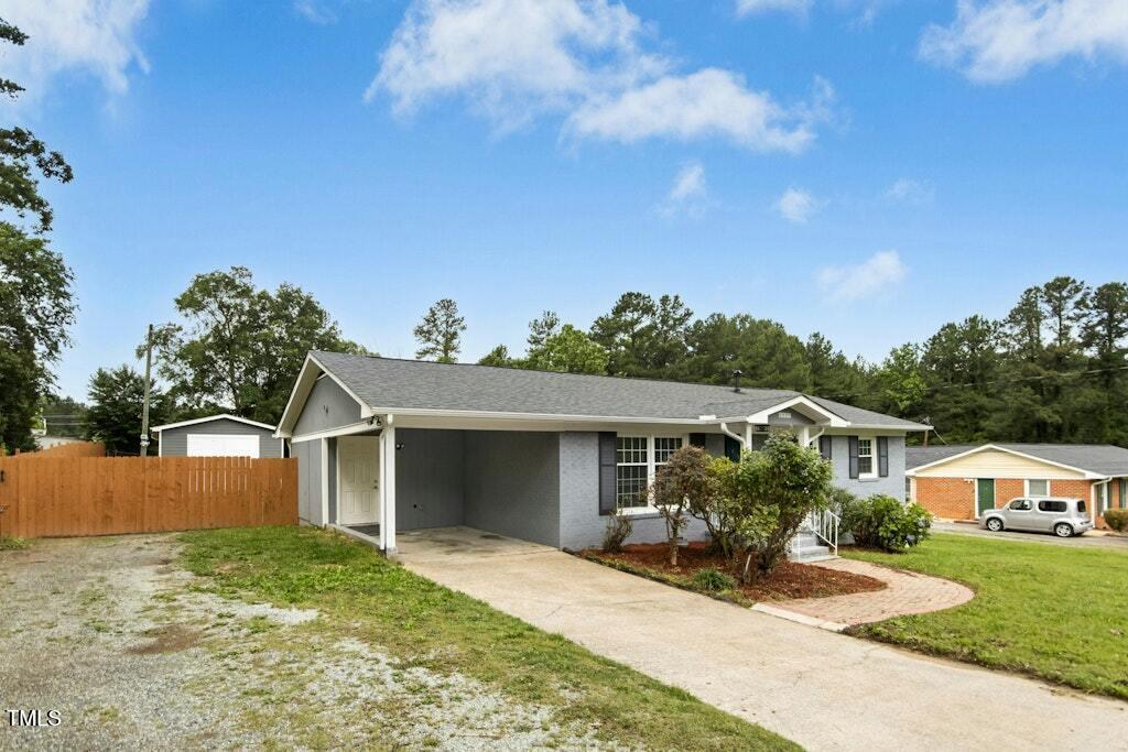4021 Chaucer Drive Durham, NC 27705 - Photo 4 of 36 front view of a house with a yard