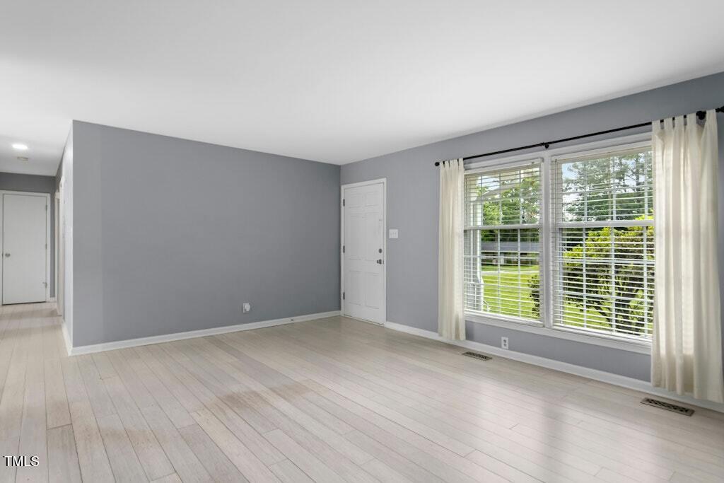 4021 Chaucer Drive Durham, NC 27705 - Photo 8 of 36 a view of an empty room with a window