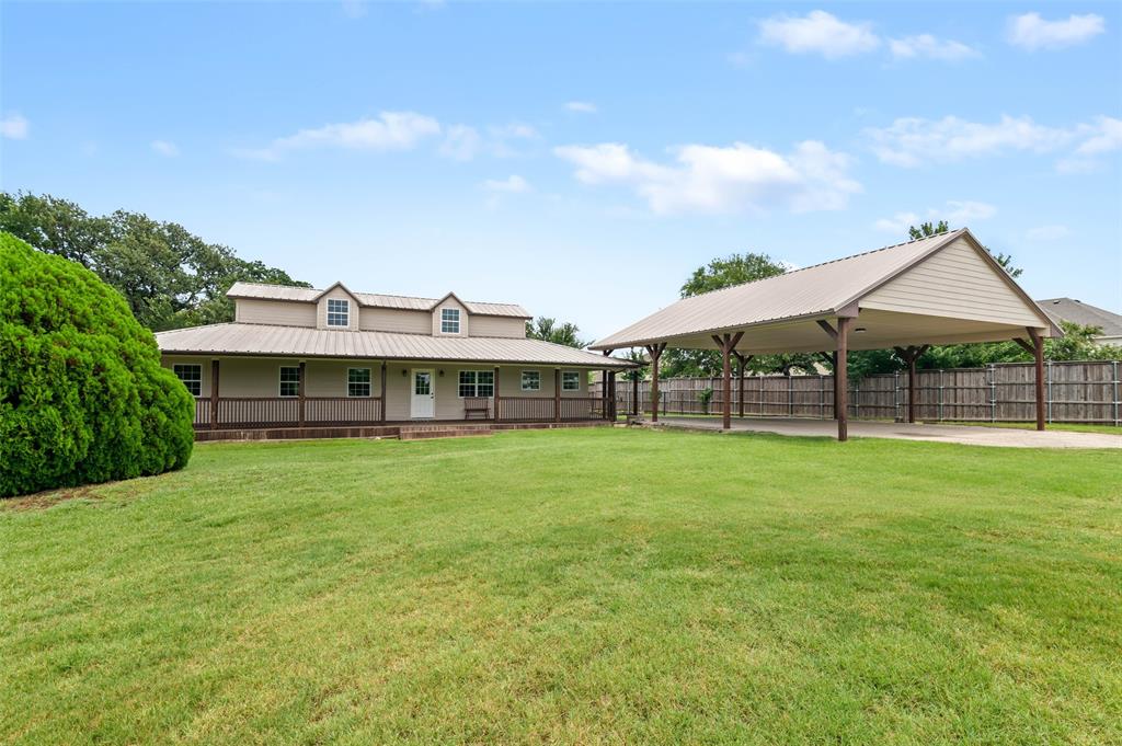 3513 Forrest Willow Road Denton, TX 76208 - Photo 1 of 1 View of yard with covered porch