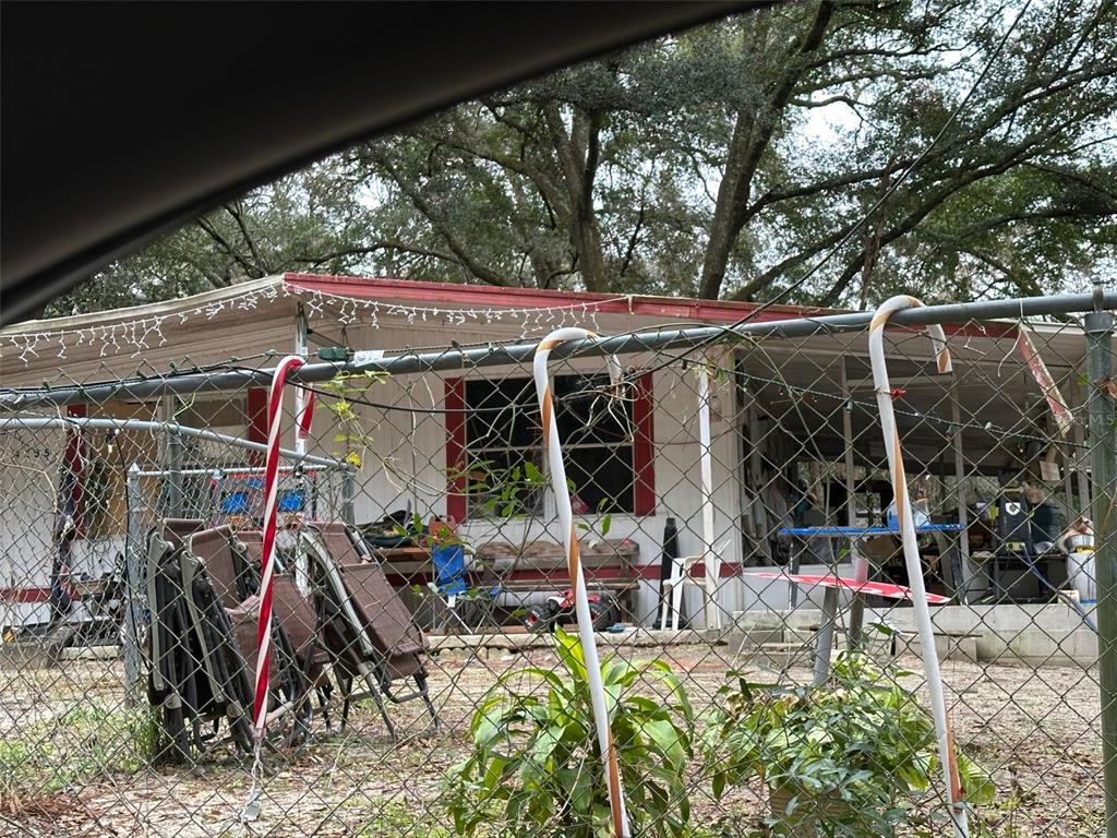 4375 East Archer Lane Inverness, FL 34452 - Photo 2 of 7 a view of a patio with table and chairs