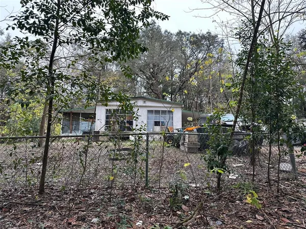 a view of house with outdoor seating space