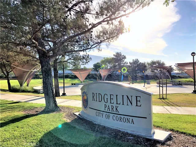 a view of outdoor space with sign board and yard