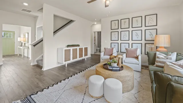 a dining room with furniture and wooden floor