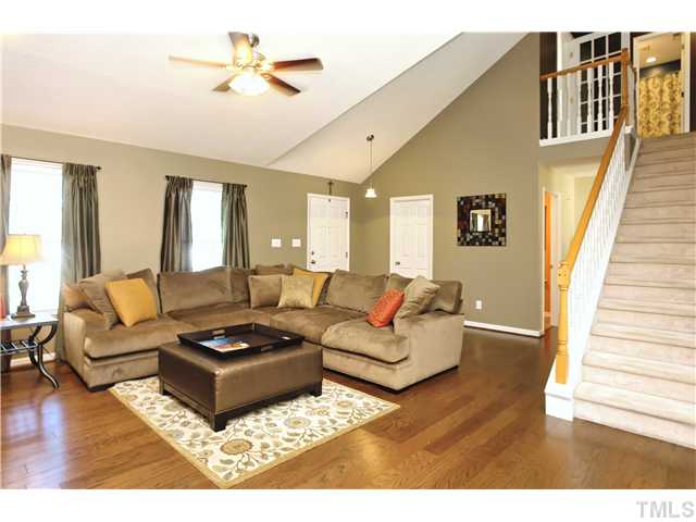 2341 Millstaff Court Raleigh, NC 27613 - Photo 5 of 16 a living room with furniture ceiling fan and a rug
