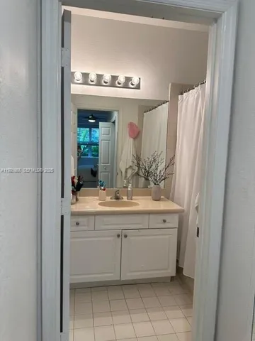 a bathroom with a sink a vanity and a mirror