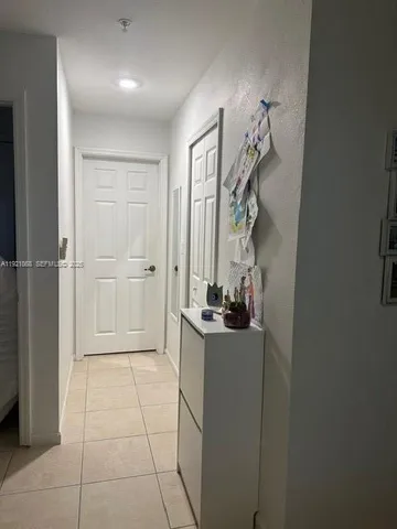 a room with a table and appliances