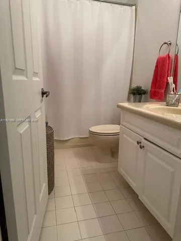 a bathroom with a toilet and a sink