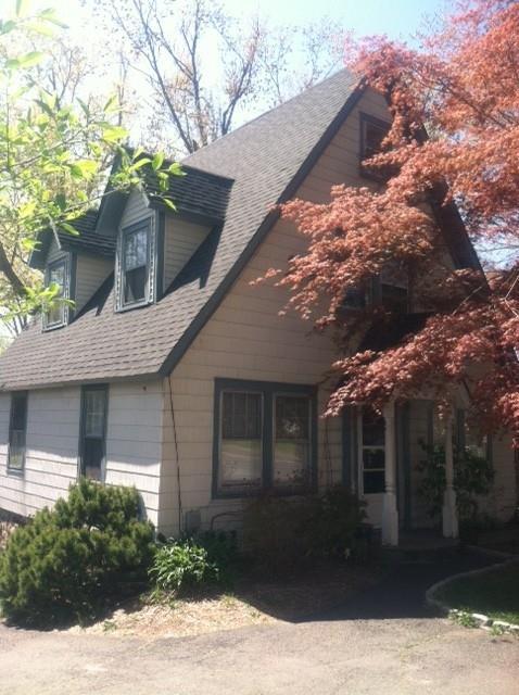 59 North Street Ridgefield, CT 06877 - Photo 1 of 1 a front view of a house with a yard