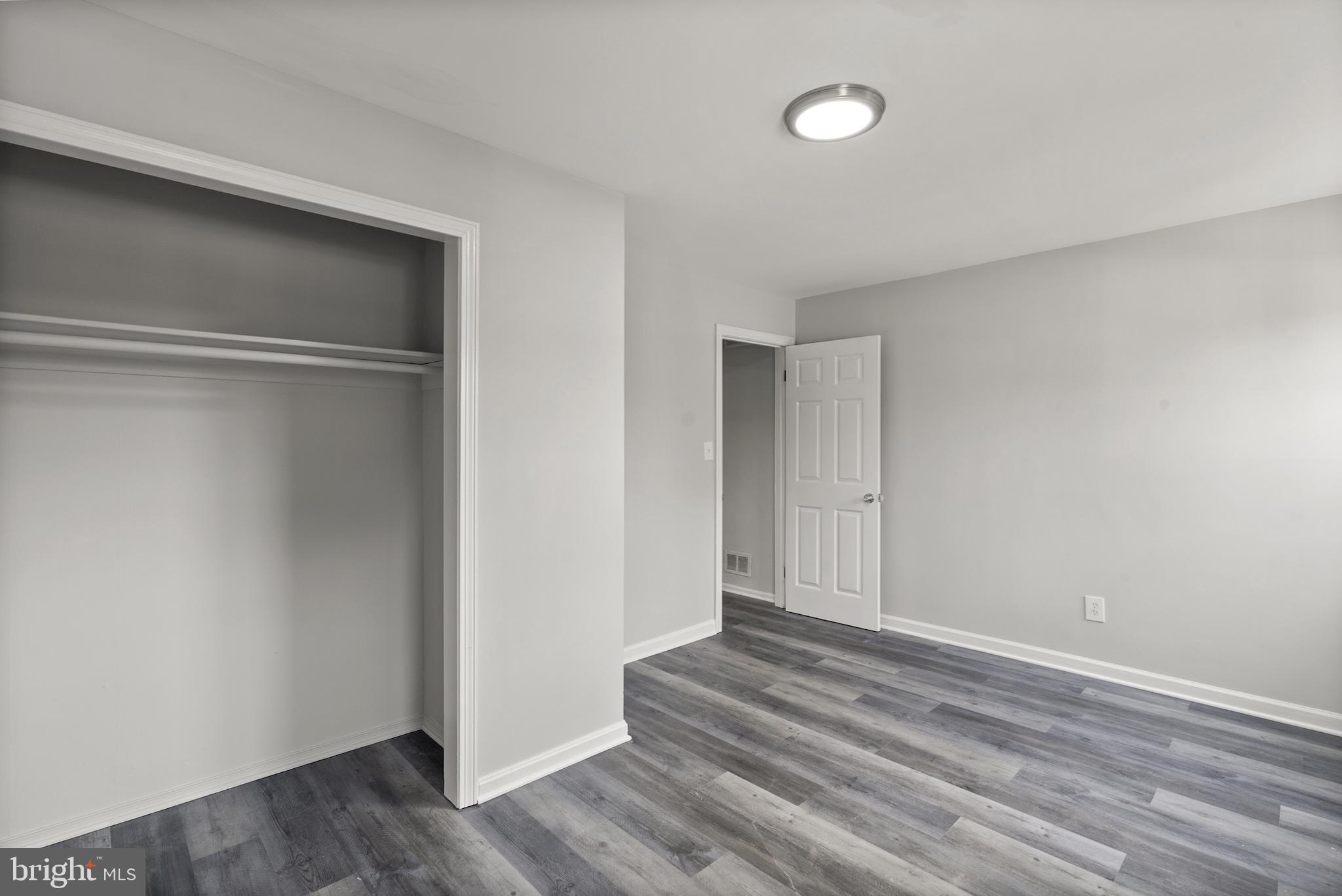 8059 Gray Haven Road Dundalk, MD 21222 - Photo 12 of 22 a view of empty room with wooden floor