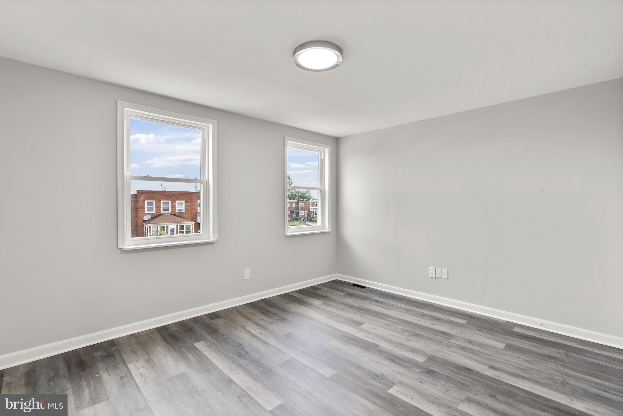 8059 Gray Haven Road Dundalk, MD 21222 - Photo 13 of 22 a view of empty room with wooden floor