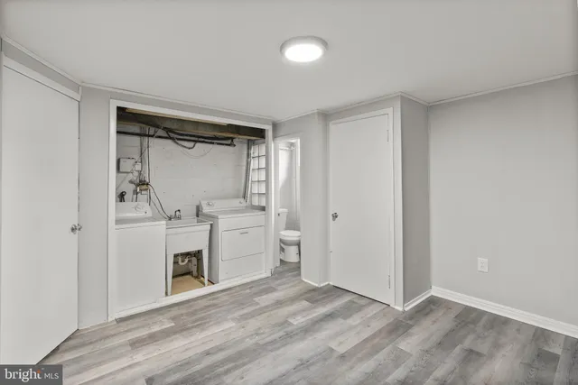 a view of a storage & utility room with washer and dryer
