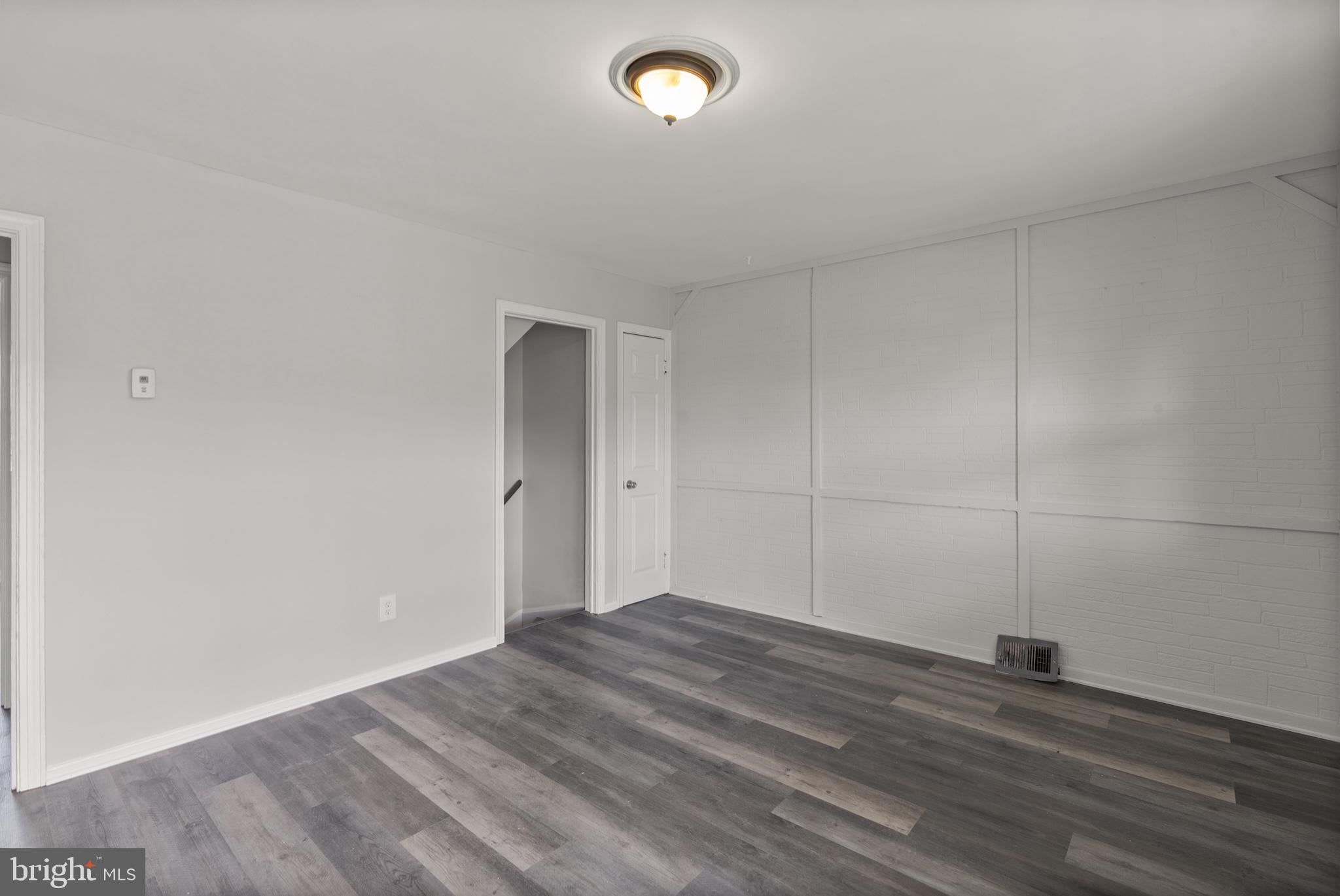 8059 Gray Haven Road Dundalk, MD 21222 - Photo 9 of 22 a view of empty room with wooden floor
