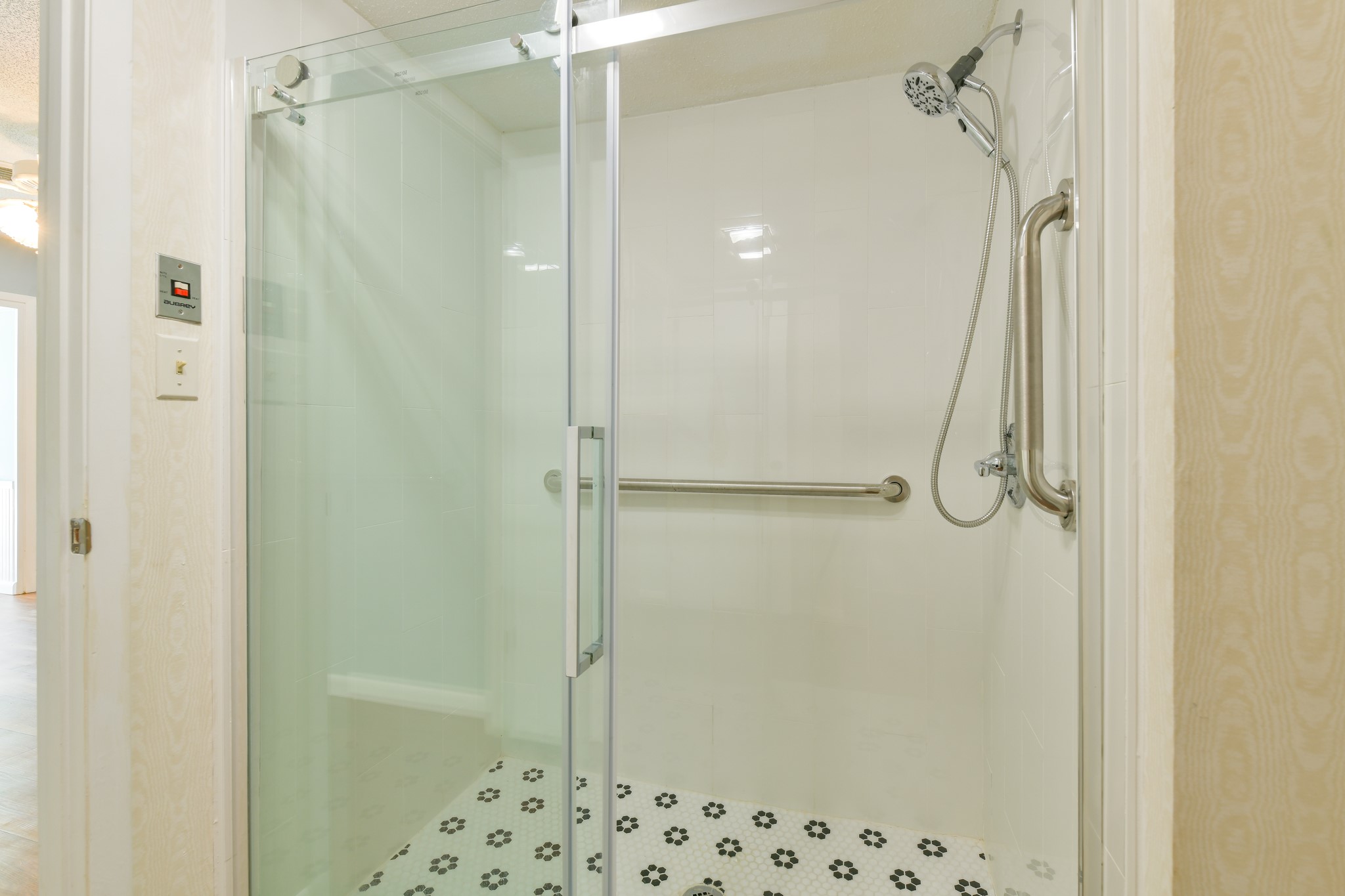 325 East Main Street Brenham, TX 77833 - Photo 5 of 9 a bathroom with a shower and a glass door