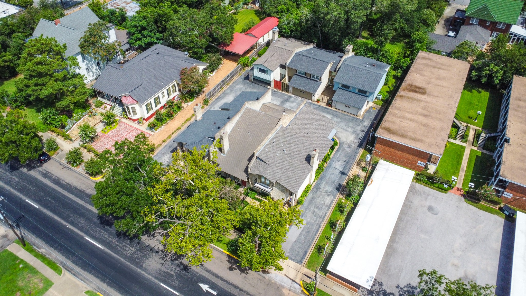 325 East Main Street Brenham, TX 77833 - Photo 9 of 9 an aerial view of a house with garden space and street view