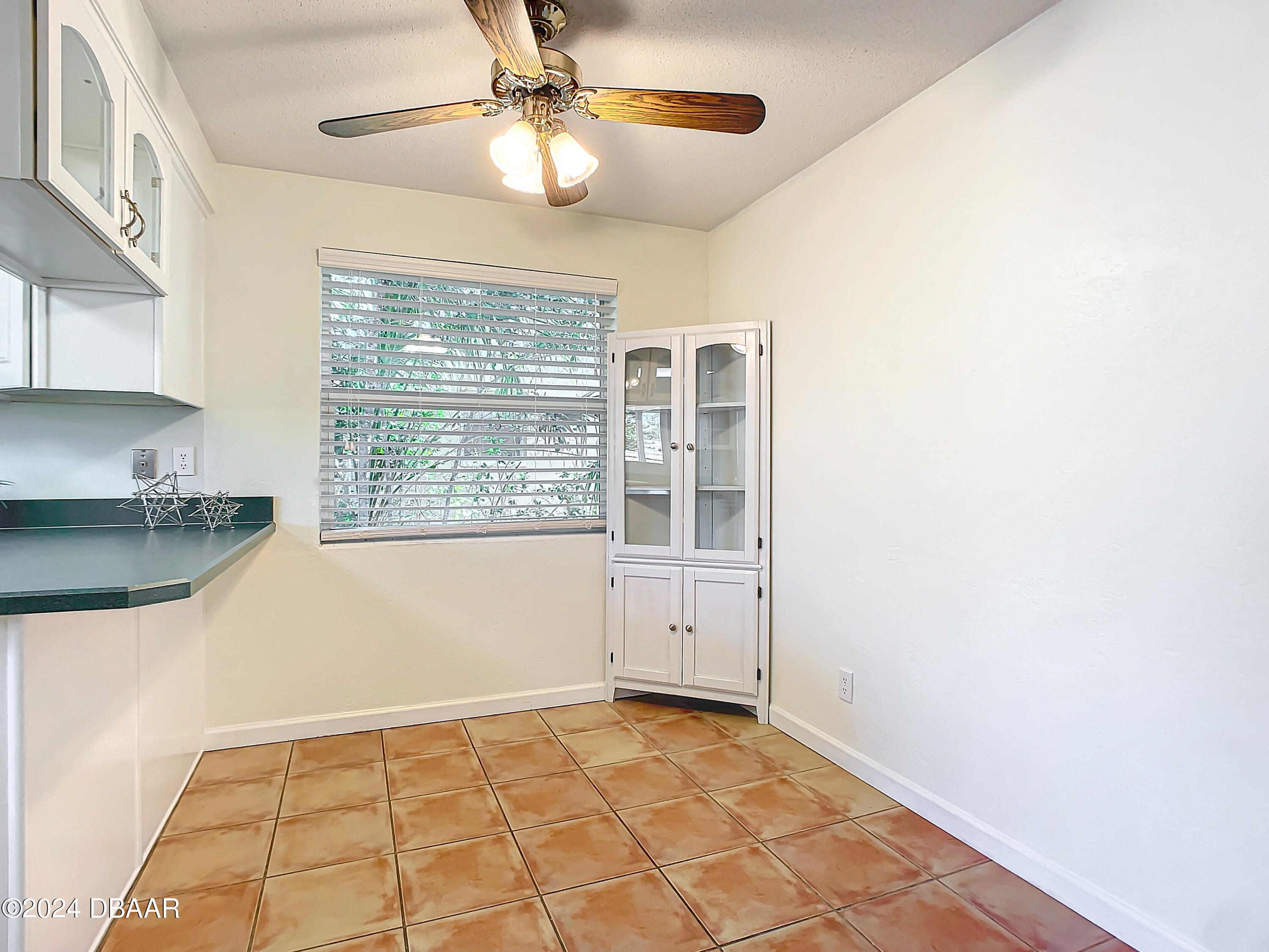 55 Merrywood Circle Ormond Beach, FL 32174 - Photo 13 of 64 a view of an empty room with window and chandelier fan