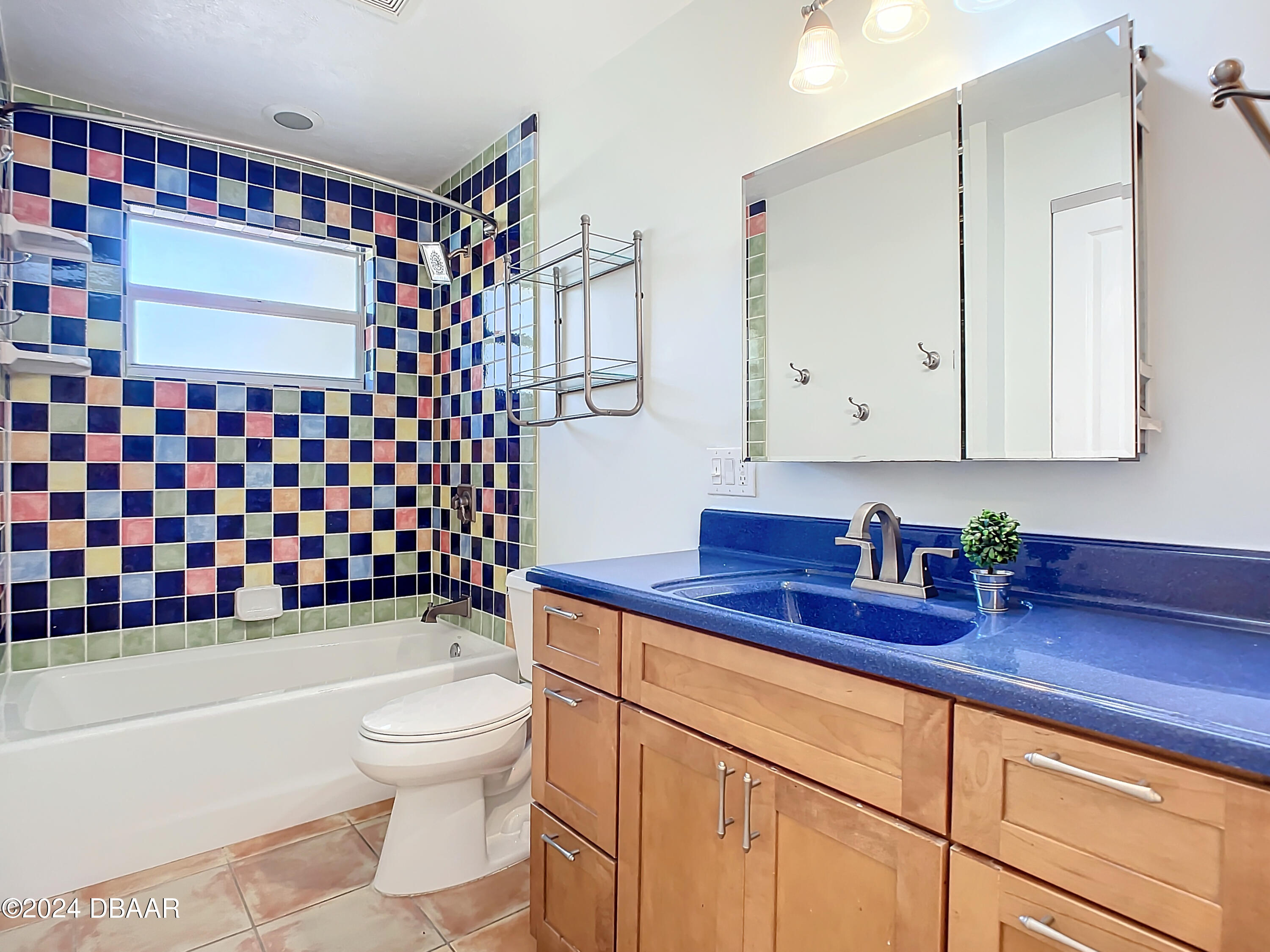 55 Merrywood Circle Ormond Beach, FL 32174 - Photo 30 of 64 a bathroom with a sink a toilet and shower