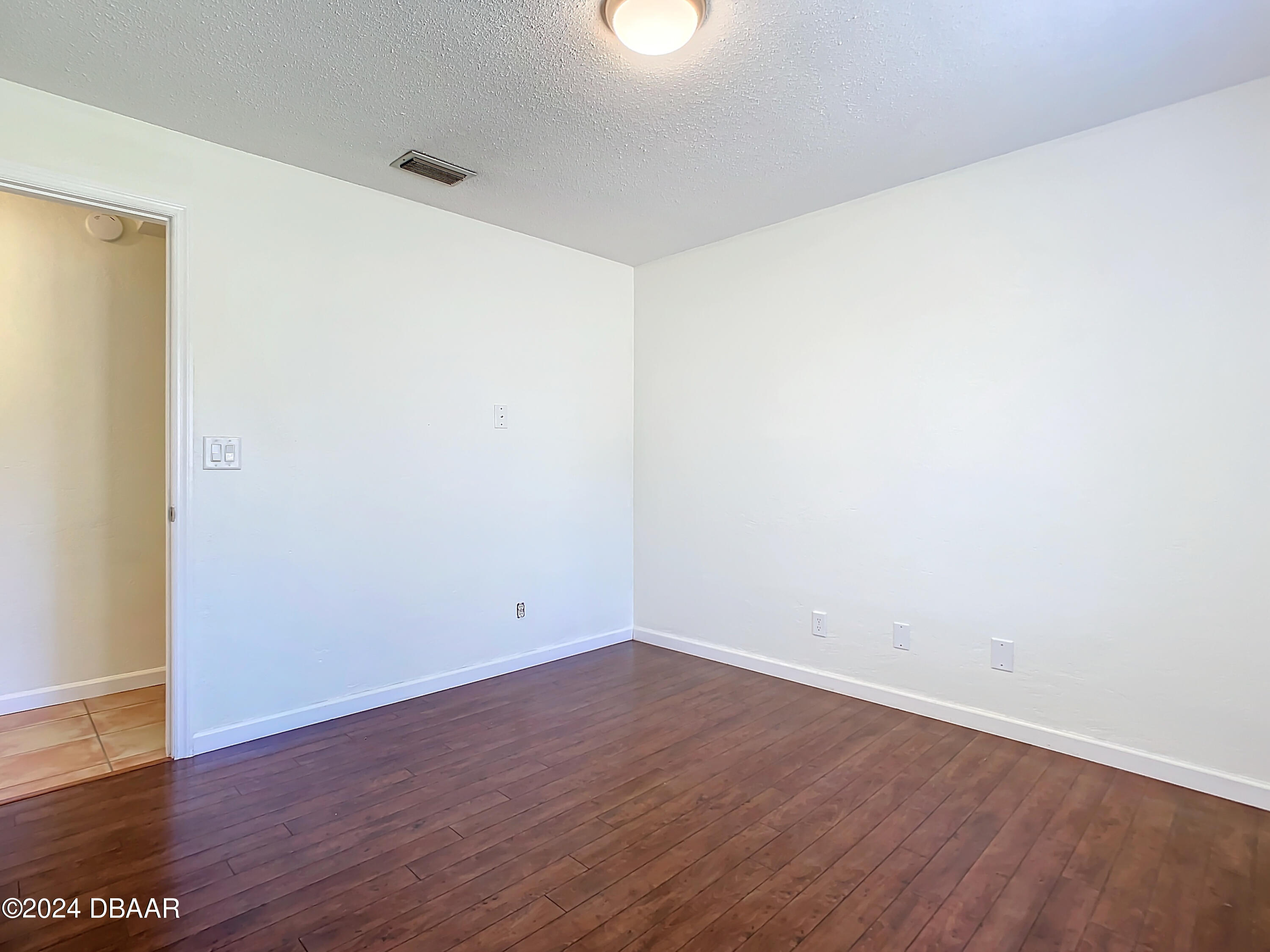 55 Merrywood Circle Ormond Beach, FL 32174 - Photo 34 of 64 an empty room with wooden floor