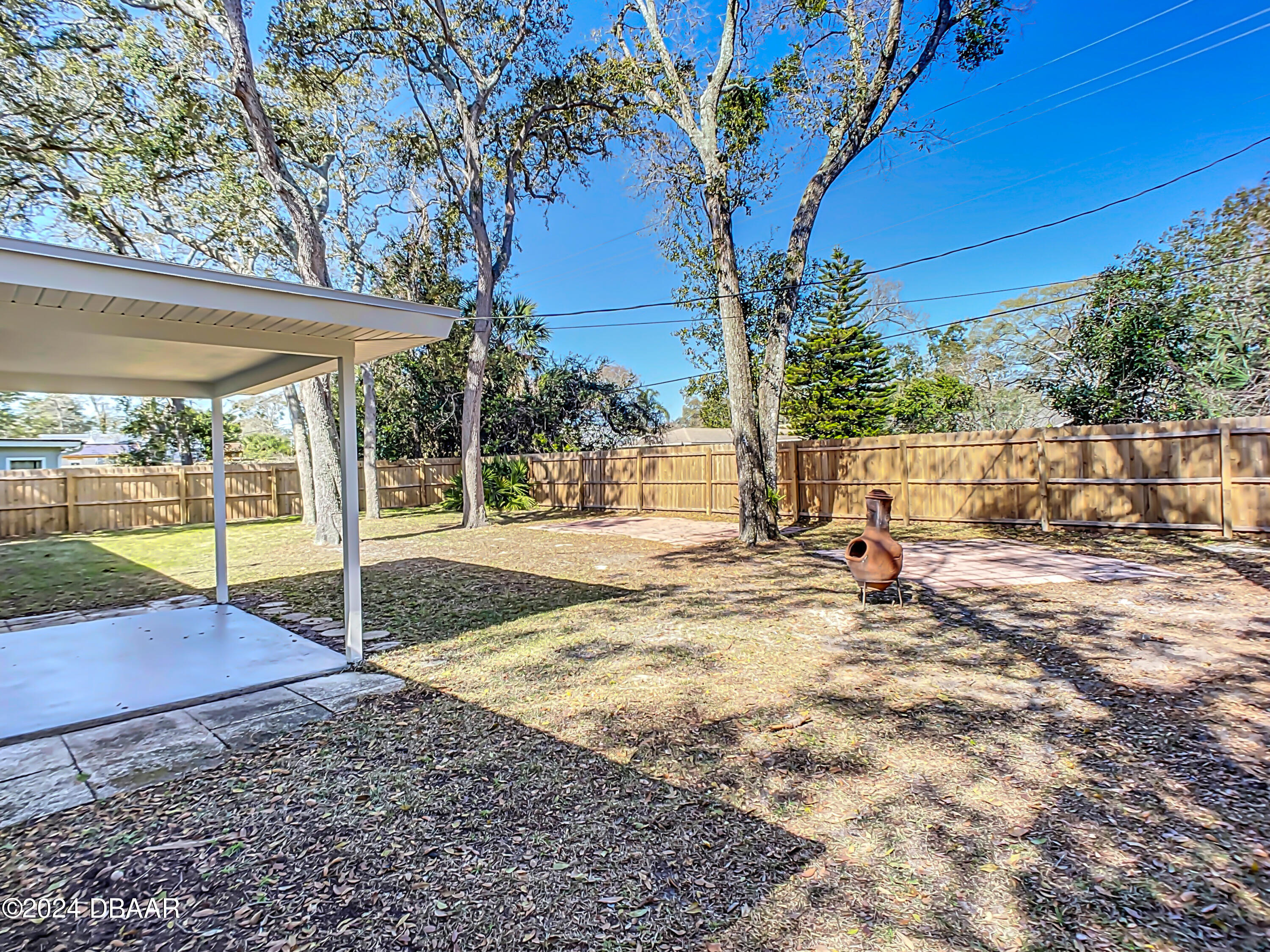 55 Merrywood Circle Ormond Beach, FL 32174 - Photo 48 of 64 a view of a backyard with a area