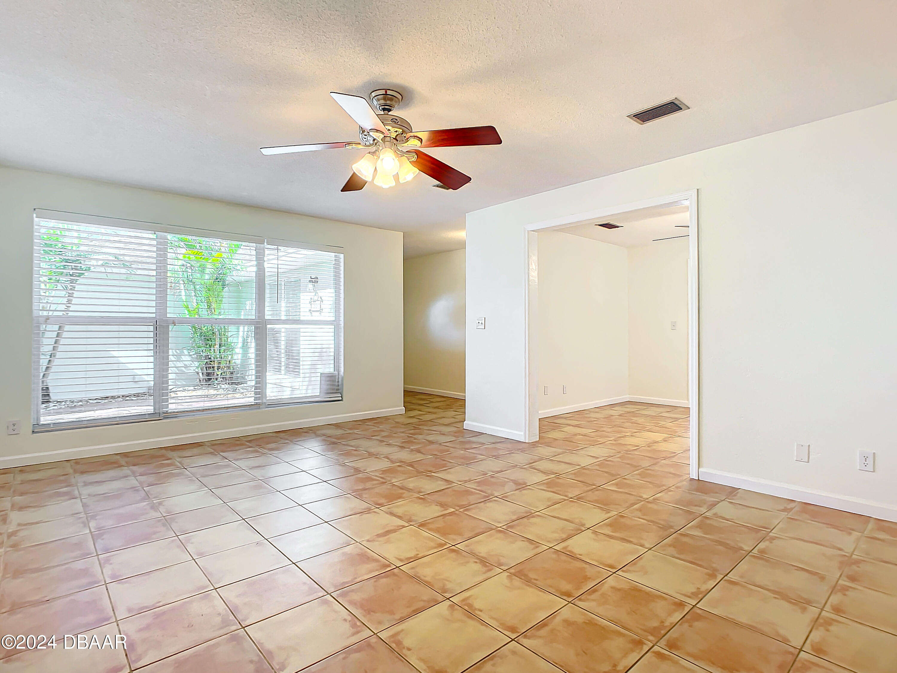 55 Merrywood Circle Ormond Beach, FL 32174 - Photo 5 of 64 a view of an empty room with a window