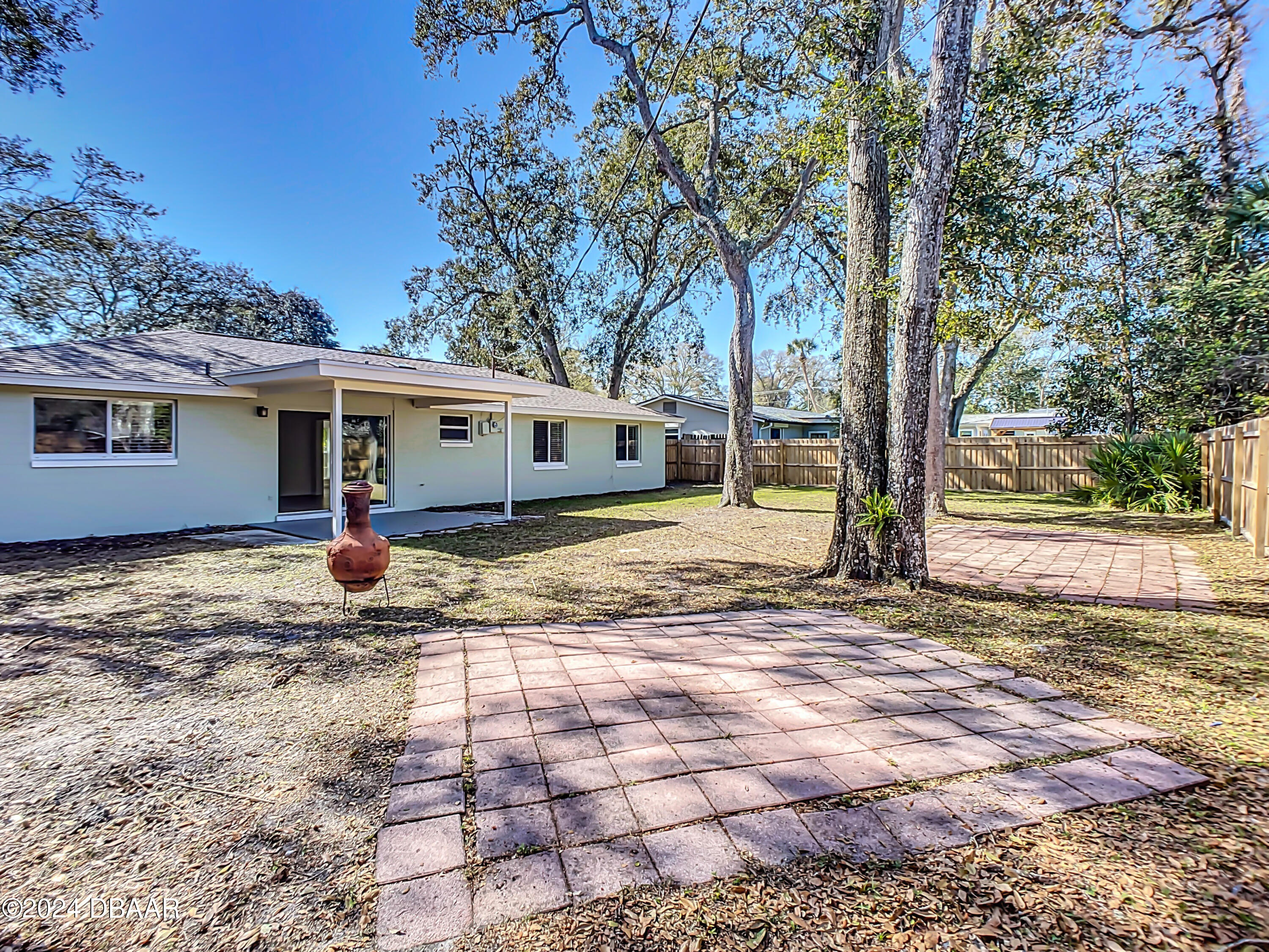 55 Merrywood Circle Ormond Beach, FL 32174 - Photo 51 of 64 a view of a house with backyard and trees