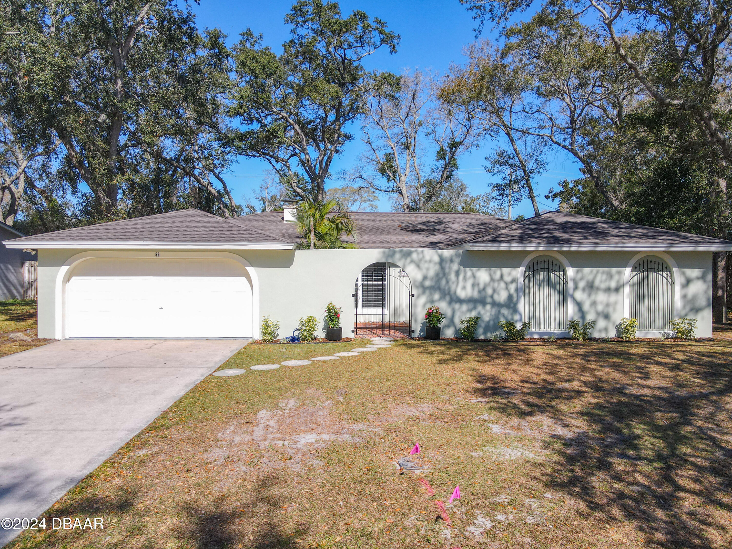 55 Merrywood Circle Ormond Beach, FL 32174 - Photo 53 of 64 a view of a house with a yard and garage