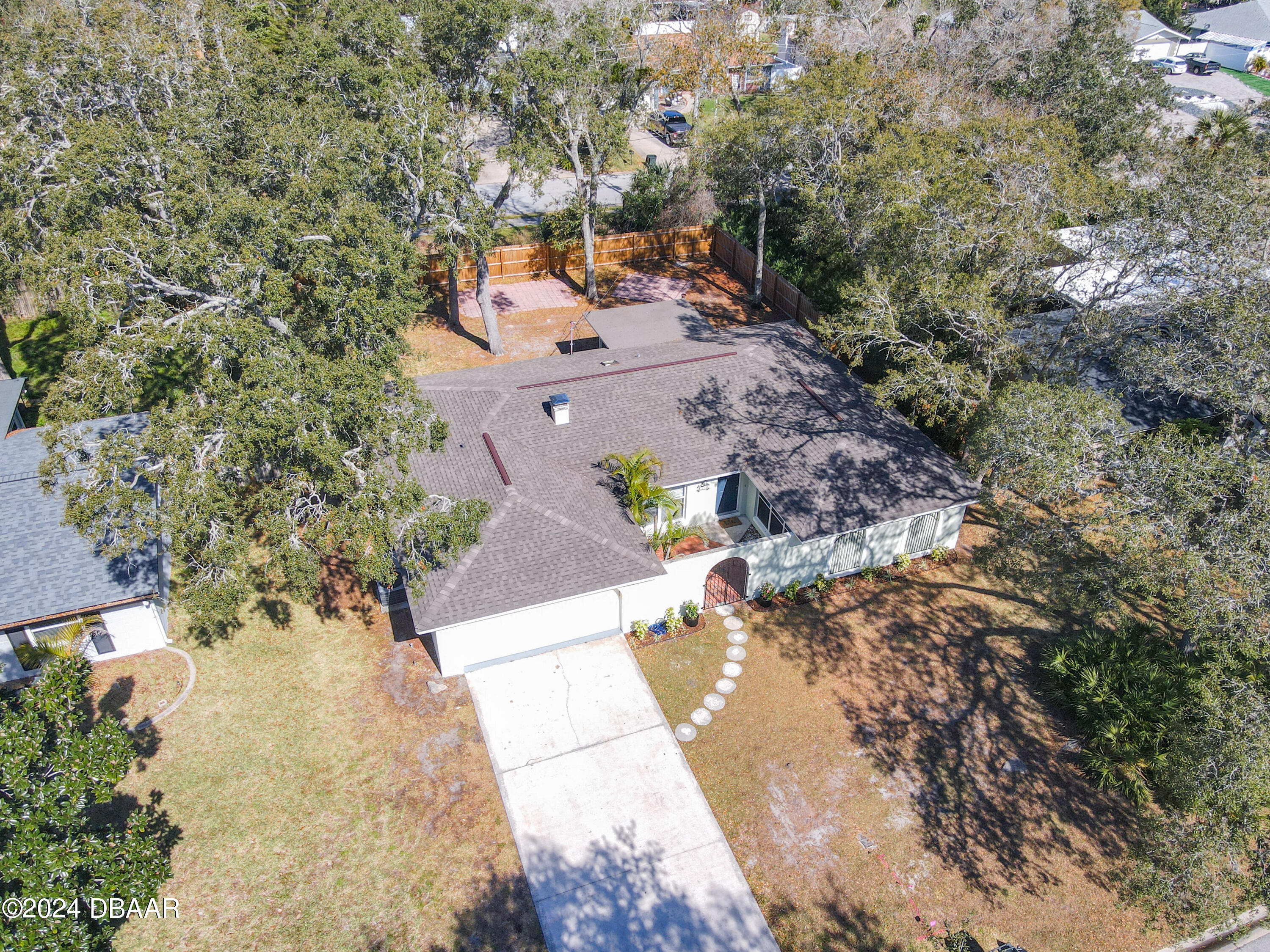 55 Merrywood Circle Ormond Beach, FL 32174 - Photo 55 of 64 an aerial view of a house with a yard and garden