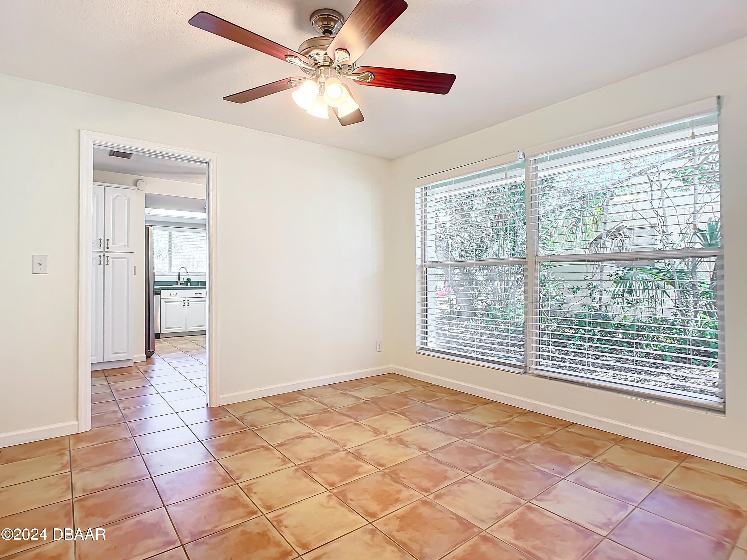 55 Merrywood Circle Ormond Beach, FL 32174 - Photo 9 of 64 a view of an empty room with a window