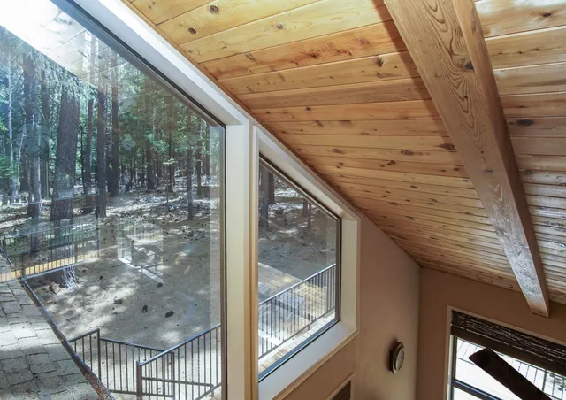 a view of balcony with wooden floor and fence