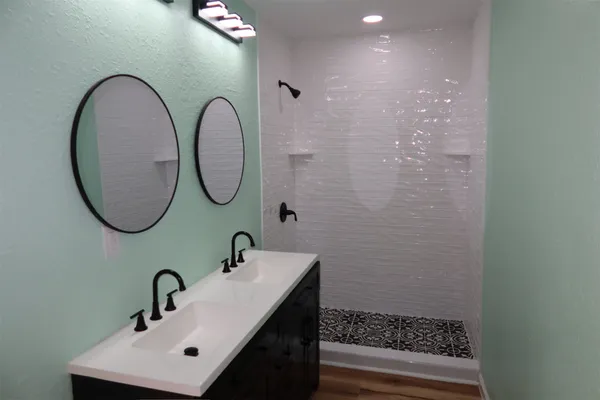 a bathroom with a sink and a mirror