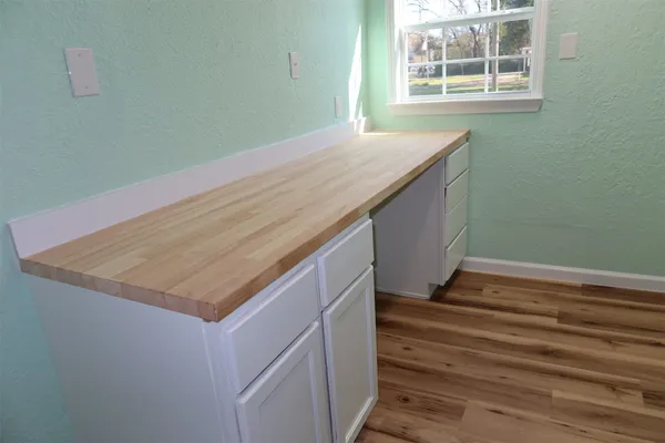 a bathroom with a sink and a window