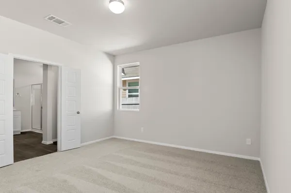 a bathroom with a shower sink vanity and mirror