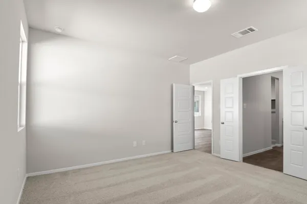 a bathroom with a double vanity sink mirror and shower