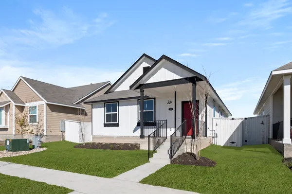 a view of a livingroom with furniture and a window