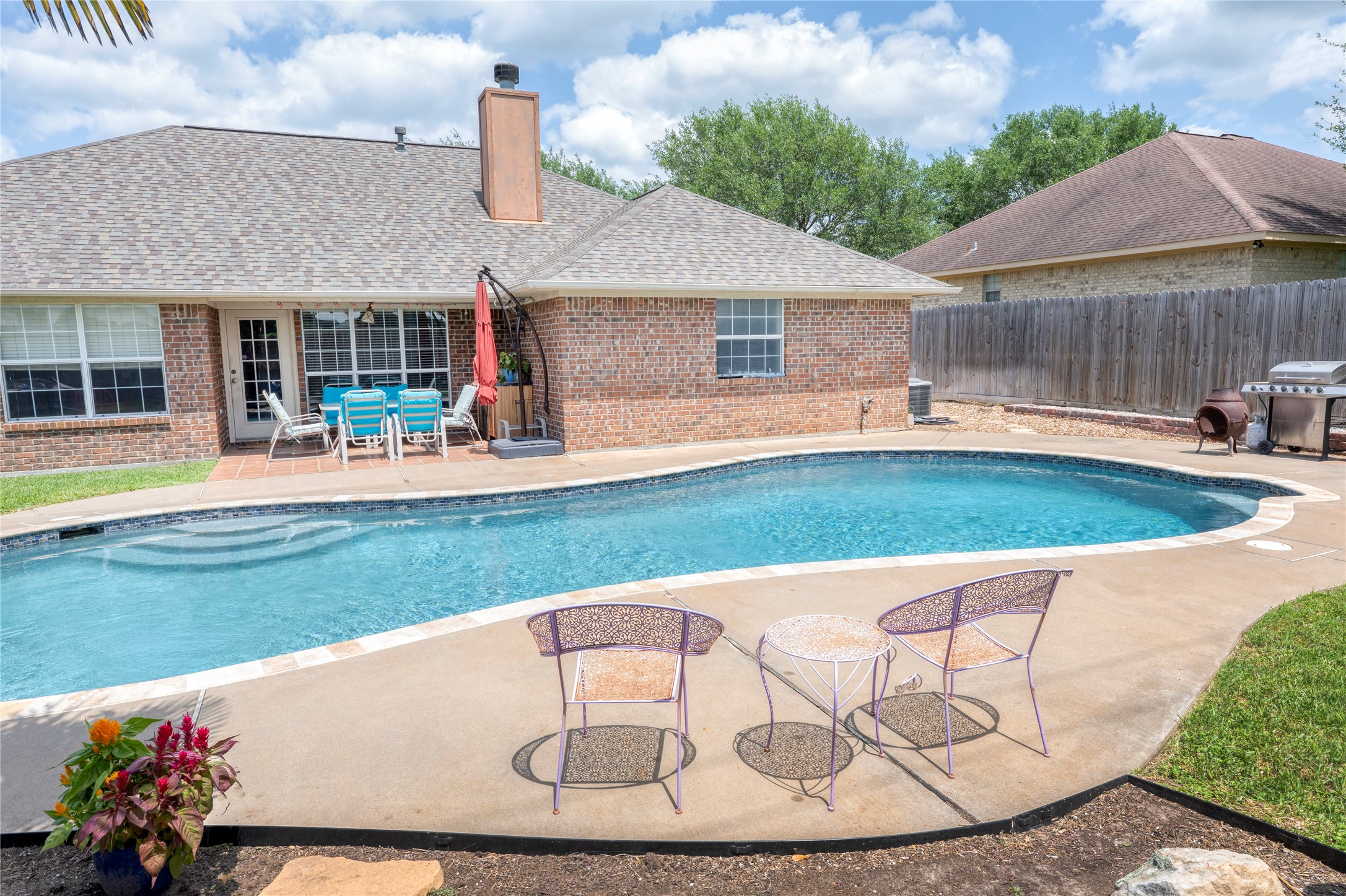 1608 Allison Street Brenham, TX 77833 - Photo 14 of 16 a view of a house with a backyard