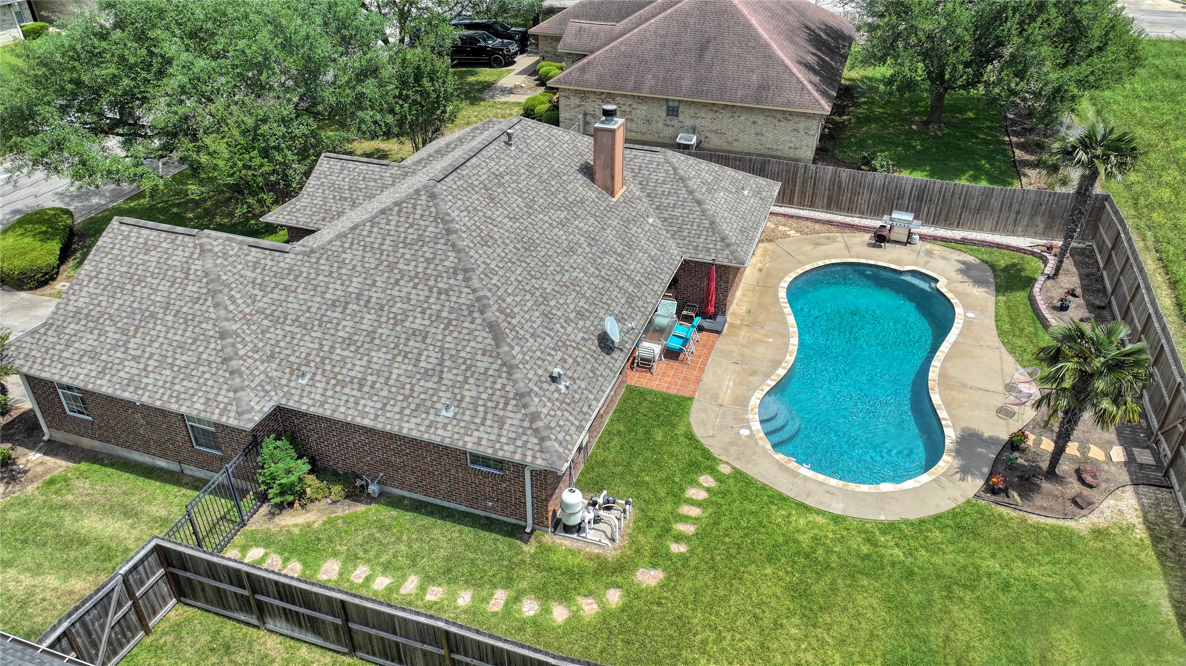 1608 Allison Street Brenham, TX 77833 - Photo 2 of 16 an aerial view of a house having swimming pool garden and patio