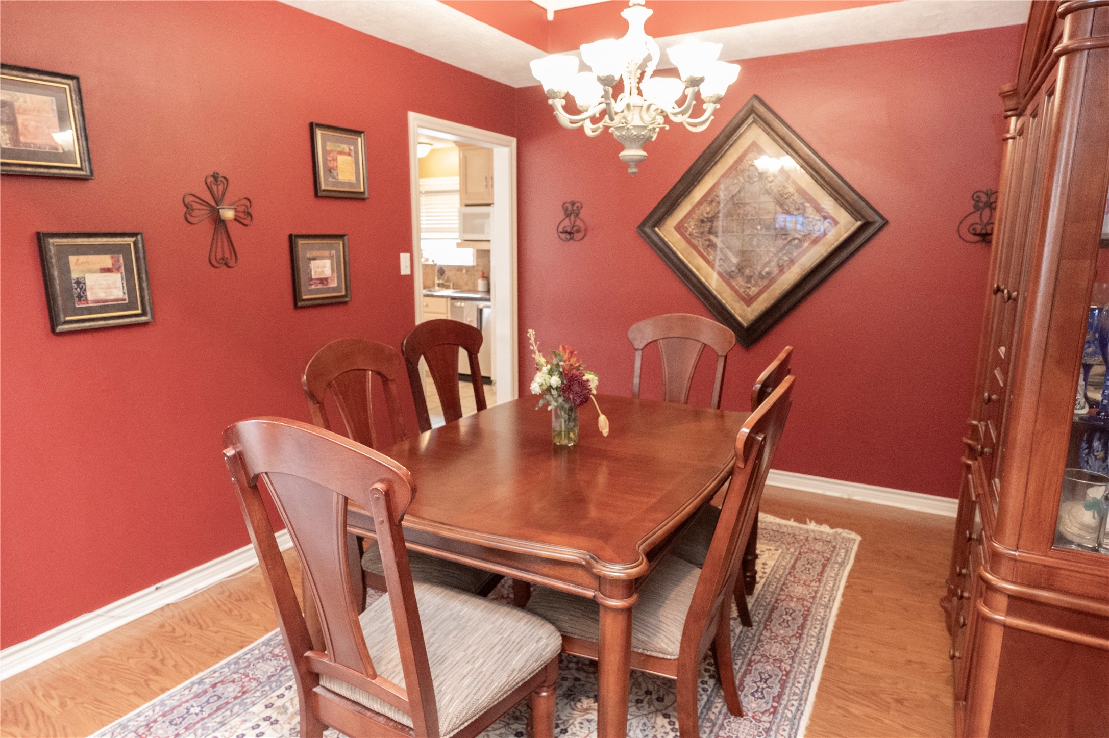 1608 Allison Street Brenham, TX 77833 - Photo 5 of 16 a dining room with furniture and chandelier