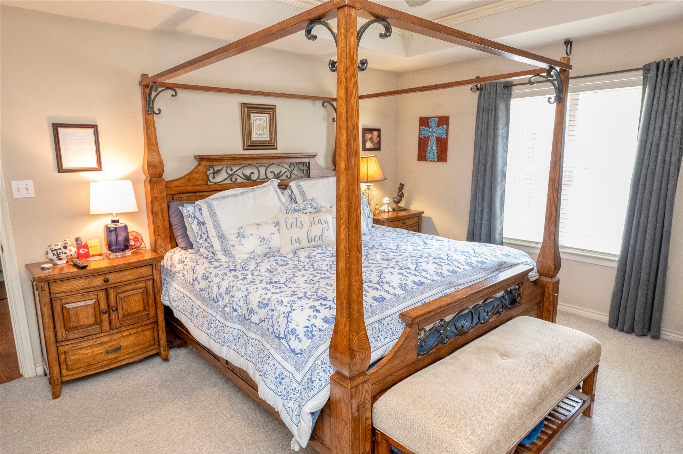 1608 Allison Street Brenham, TX 77833 - Photo 8 of 16 a bedroom with a bed and a dresser with mirror