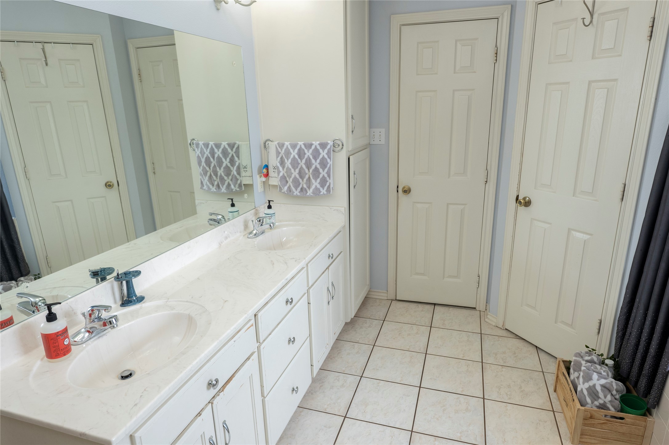 1608 Allison Street Brenham, TX 77833 - Photo 9 of 16 a bathroom with a sink and a mirror