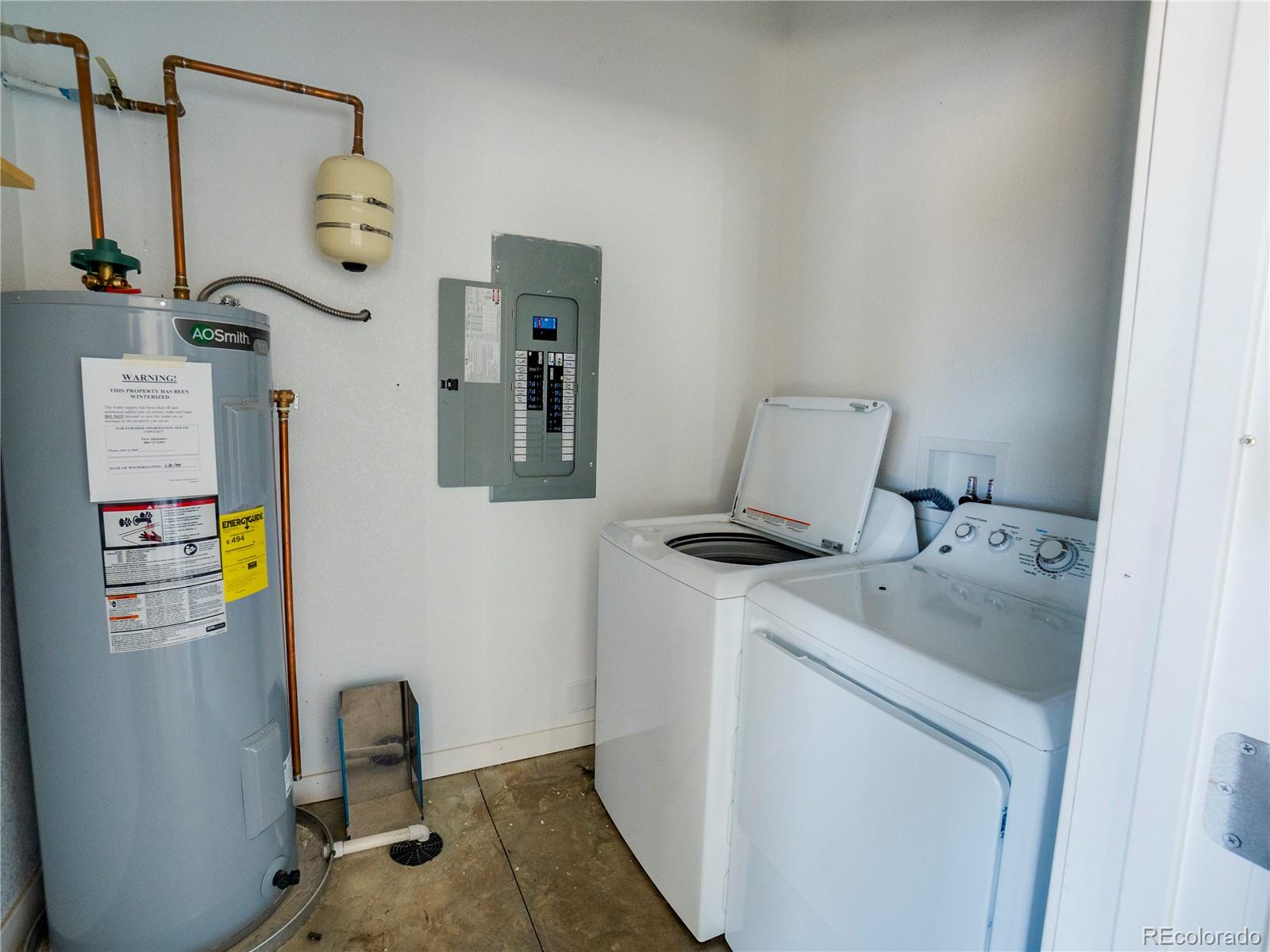491 Ketchum Road Walsenburg, CO 81089 - Photo 11 of 20 a utility room with dryer and washer