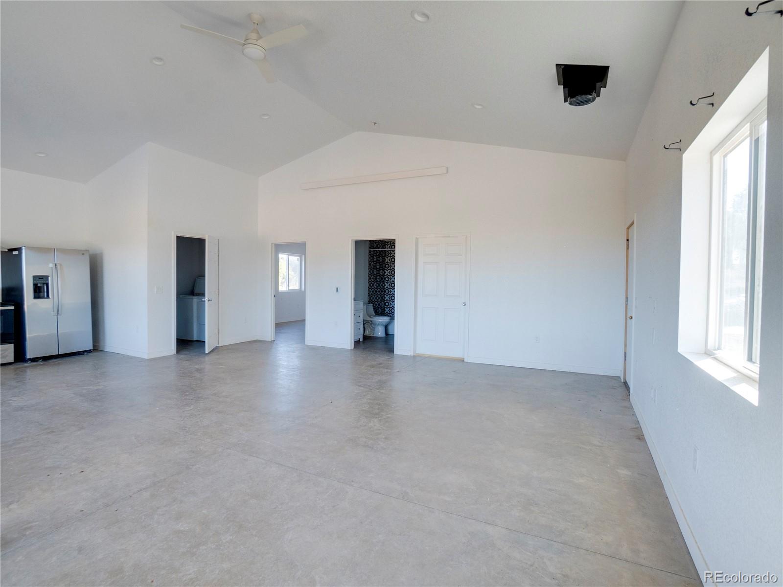 491 Ketchum Road Walsenburg, CO 81089 - Photo 17 of 20 a view of a livingroom with an empty space and a window